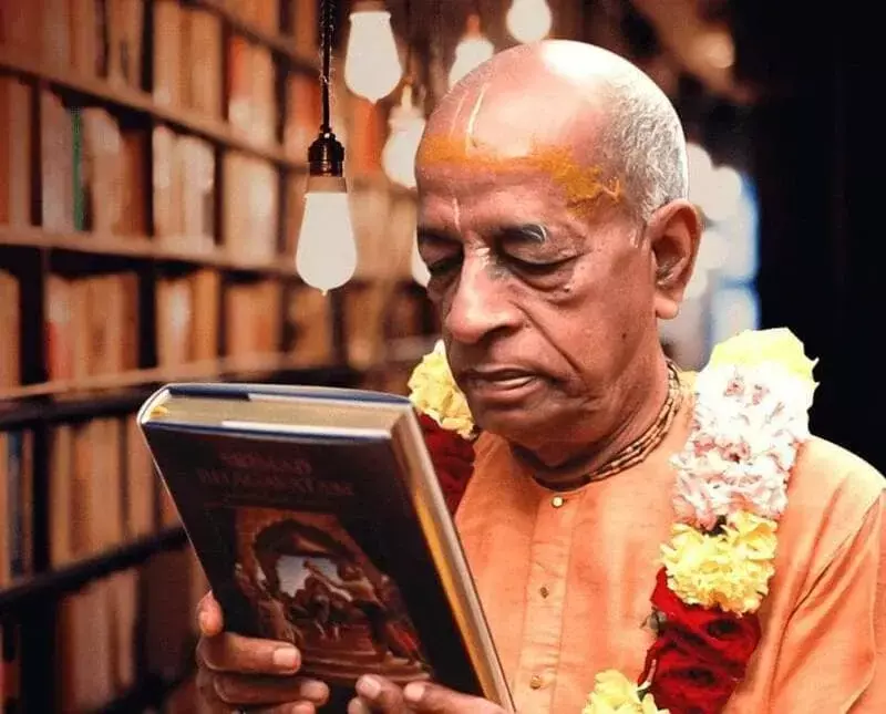 Srila Prabhupada holding Srimad Bhagavatam