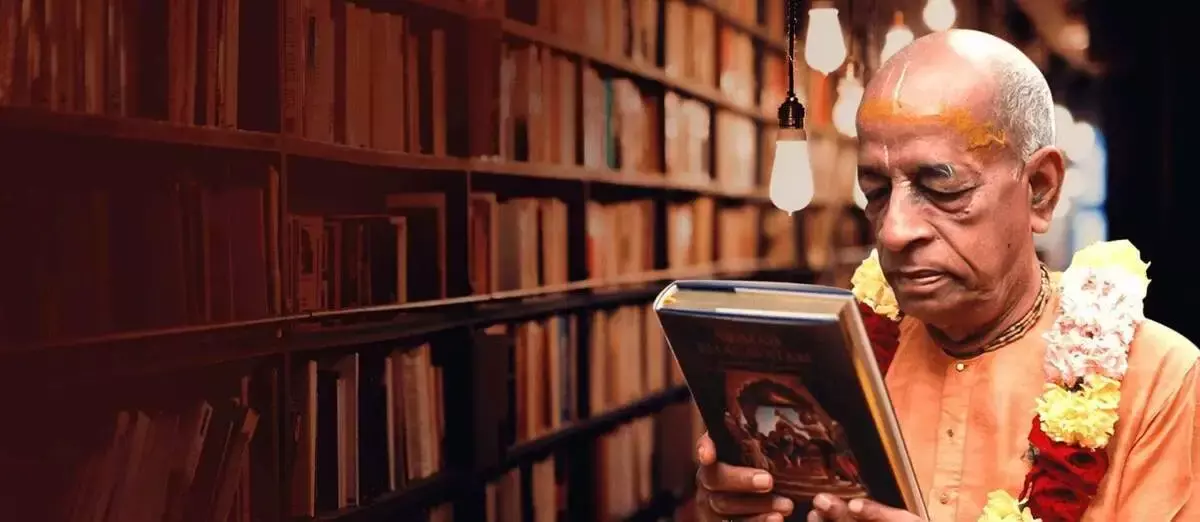 Srila Prabhupada holding Srimad Bhagavatam